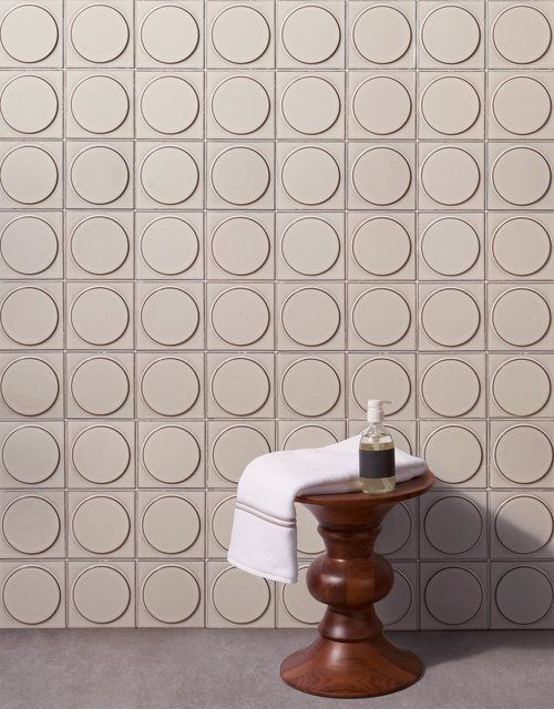 Circle in square repeating wall pattern.