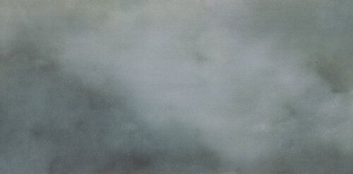 Closeup of finish of a tile that looks like dark clouds.