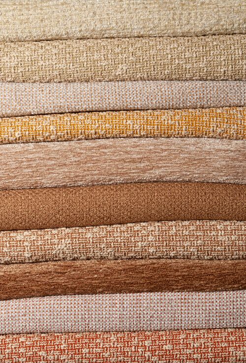 Stack of woven rugs.