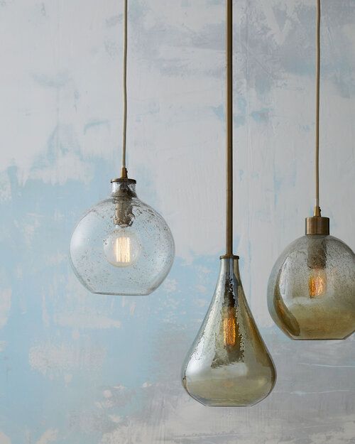 Blown darkened glass pendants in different shapes.