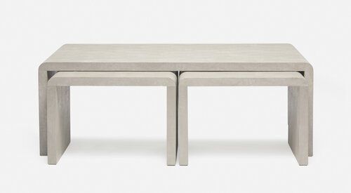 One large slab table with two smaller ones nested underneath.