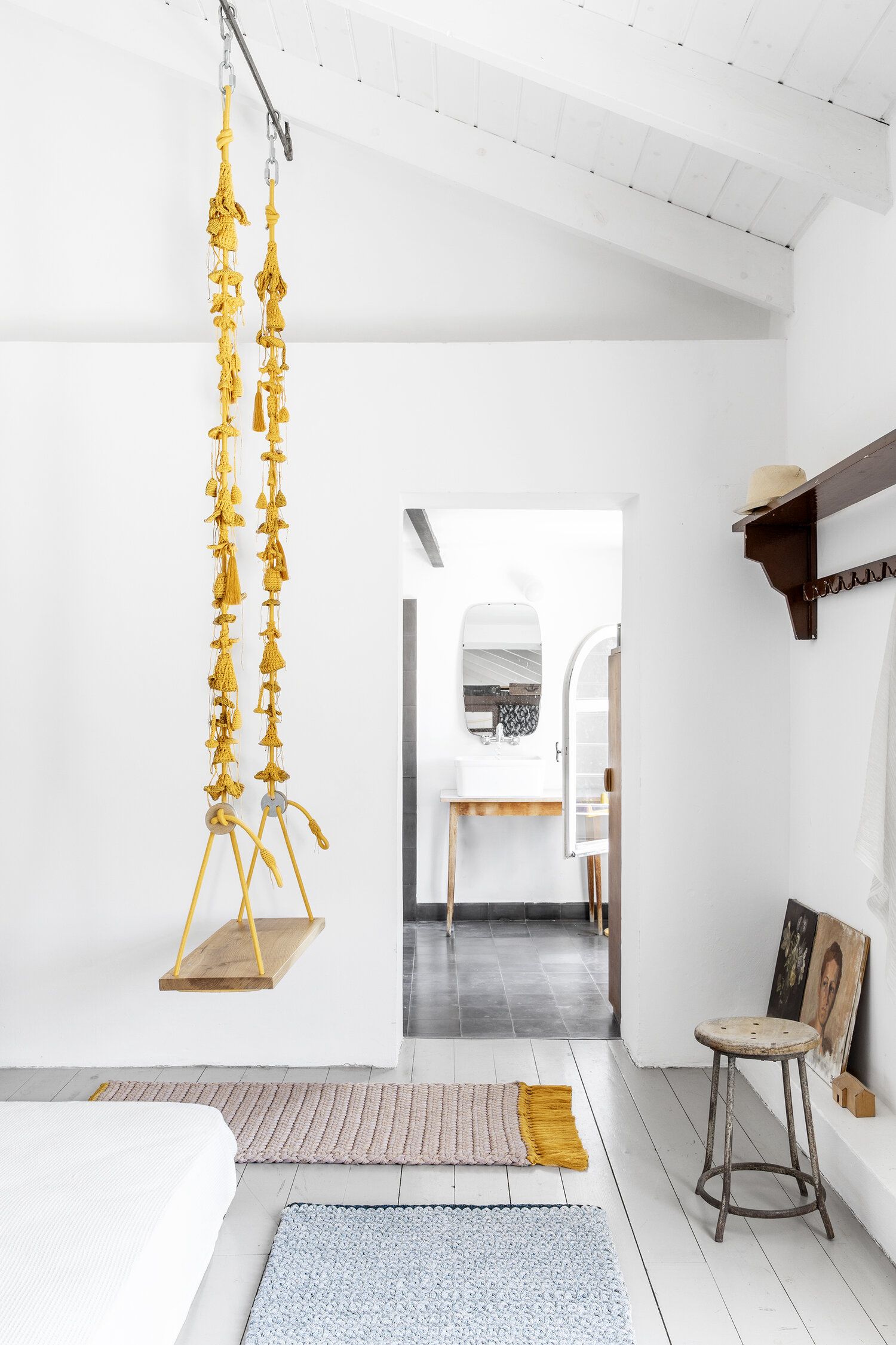 Macrame swing in an casual yet modern bedroom.