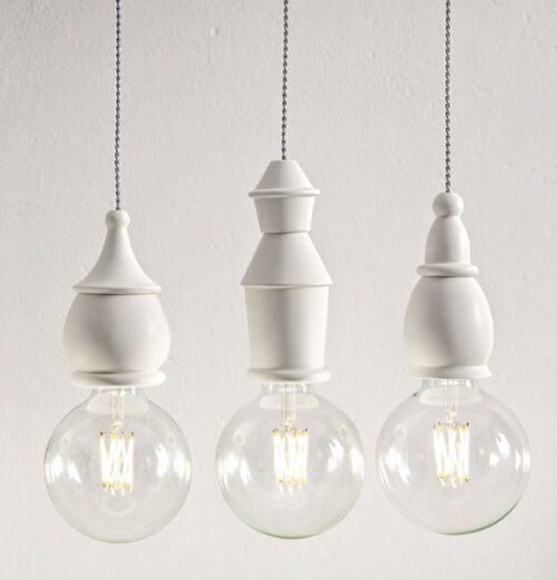 Three pendants with different stacks of shapes for fixture and lamp of round Edison bulb.