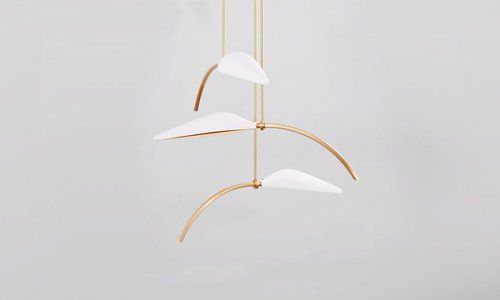 Gold and glass three piece hanging artwork.