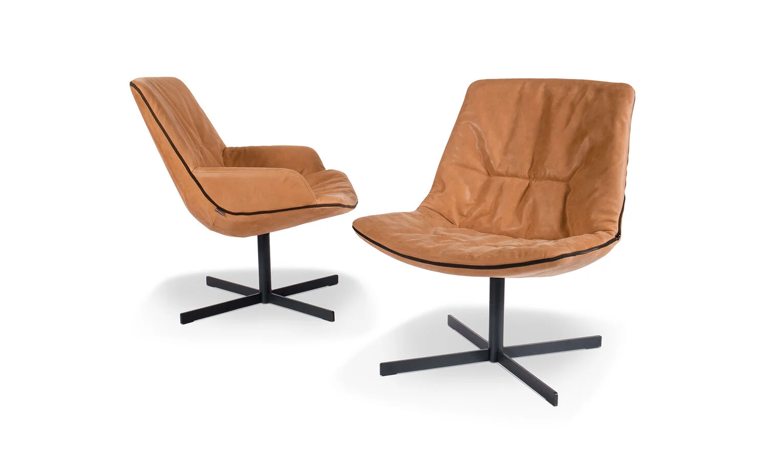 Two leather bucket chairs, one with and one without arms.