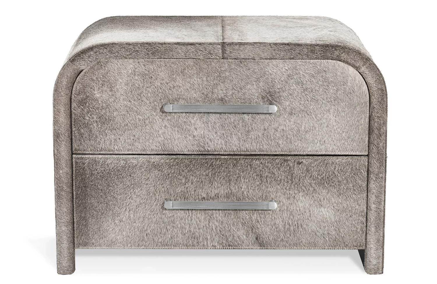 Small chest of drawers with curved corners and light metal handles. The surface has short hair.