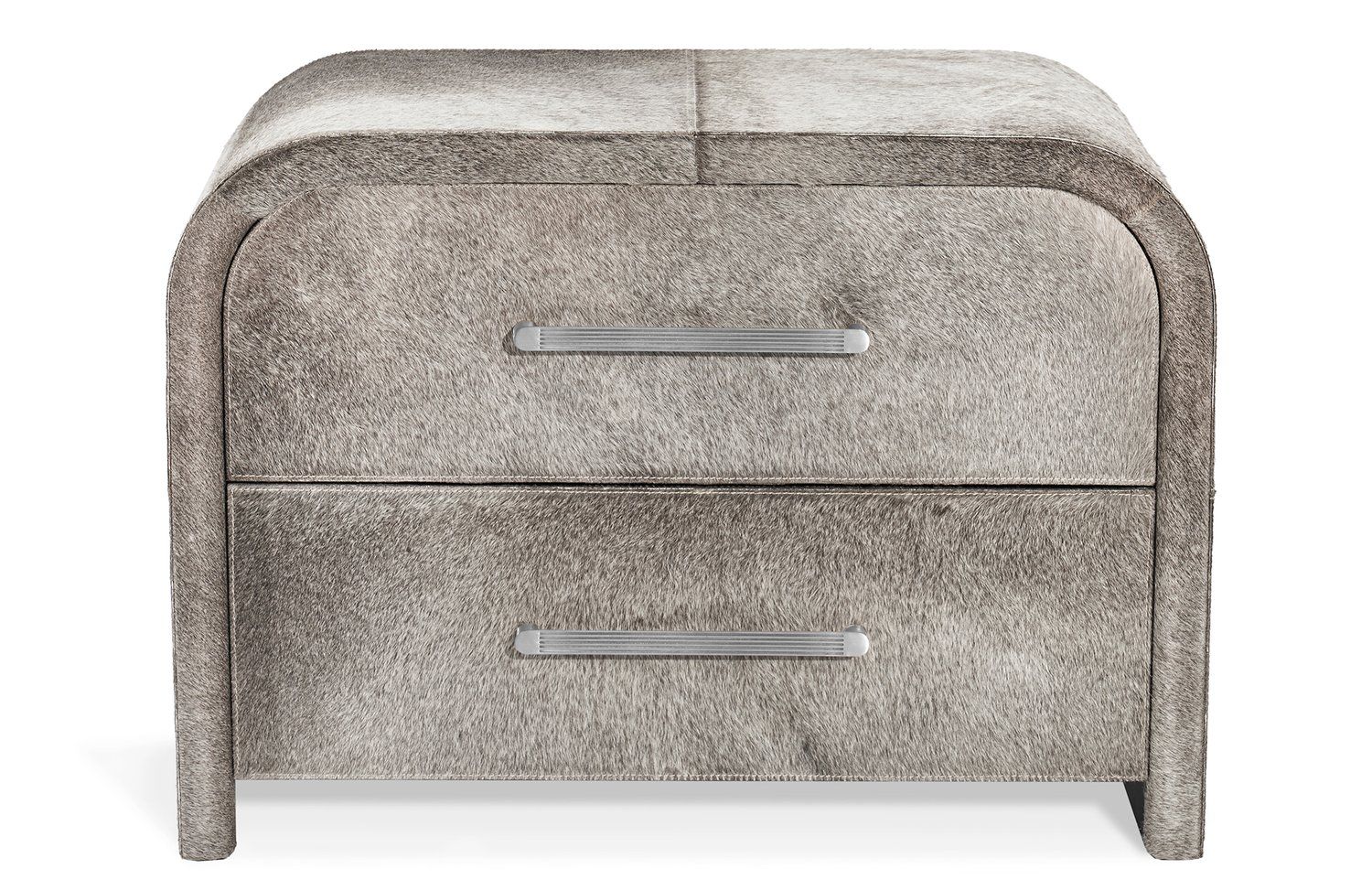 Small chest of drawers with curved corners and light metal handles. The surface has short hair.