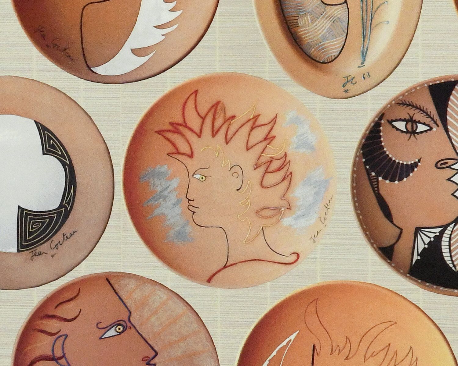 Hand painted graphics on plate shaped items.