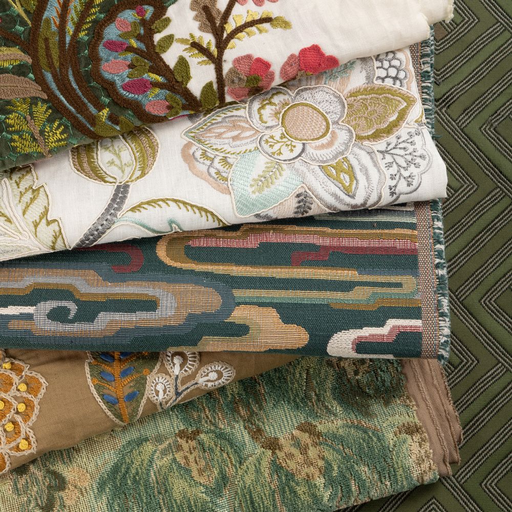 Beautiful modern living room with a modern patterned rug and highly stylized couch in foreground.