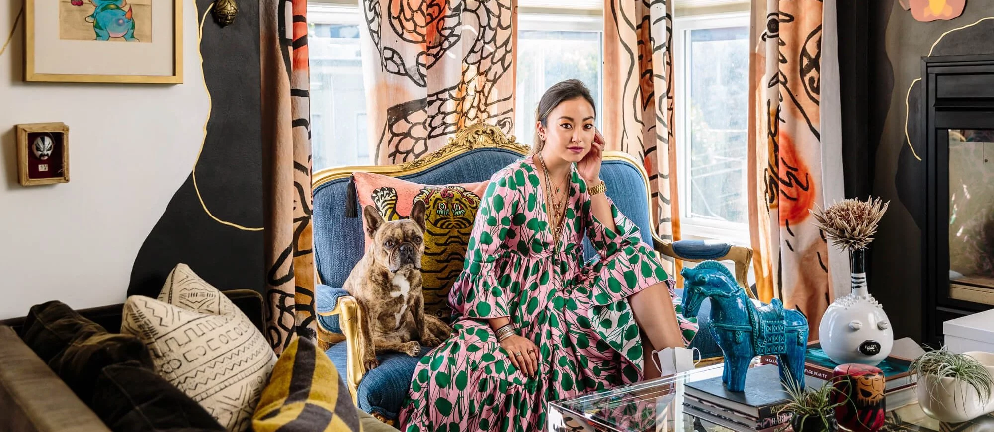 Designer and her French bulldog relaxed on coach in a room representing different patterns and textures.