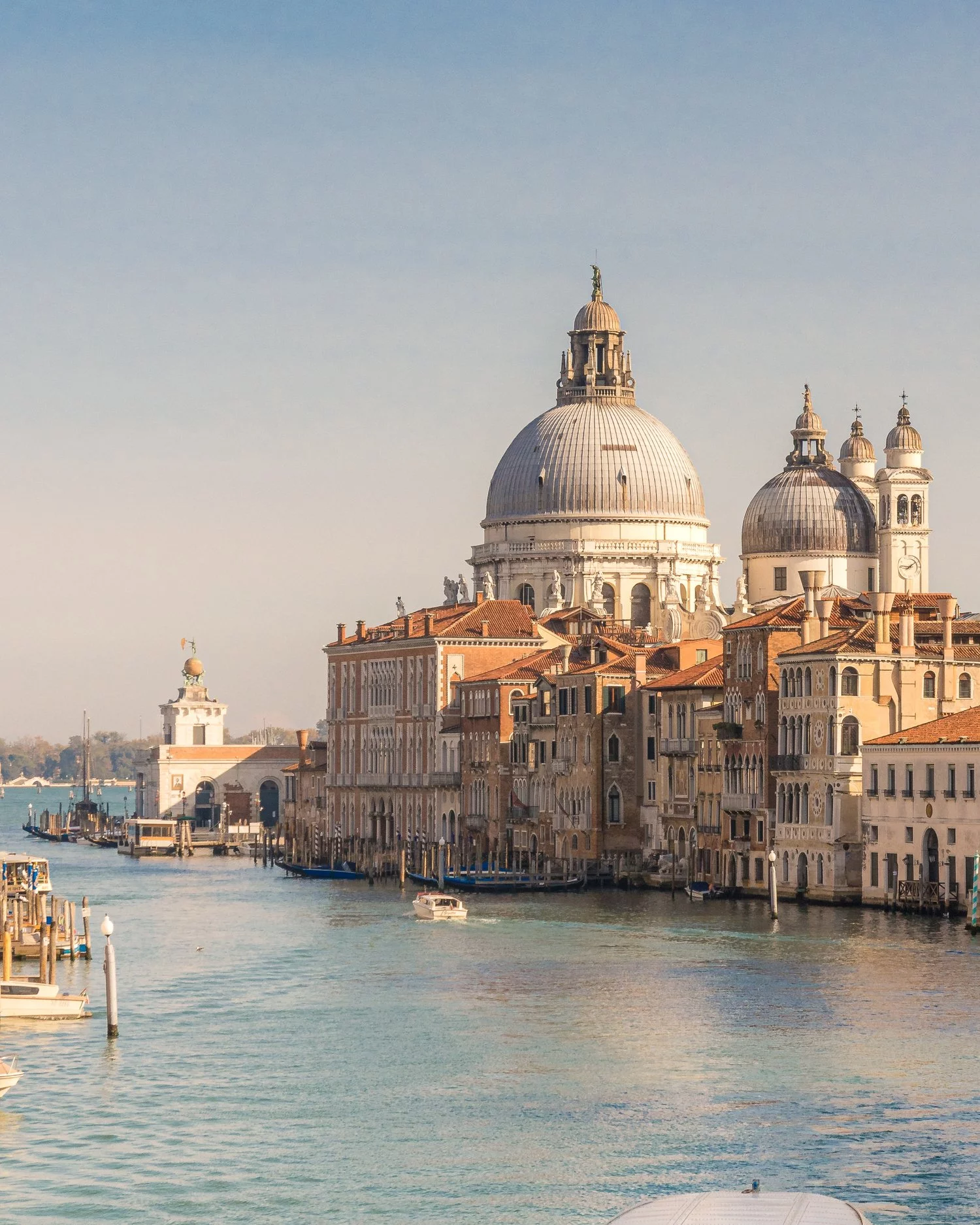 View of Santa Caterina and the grand canal of Venice on a sunny day.