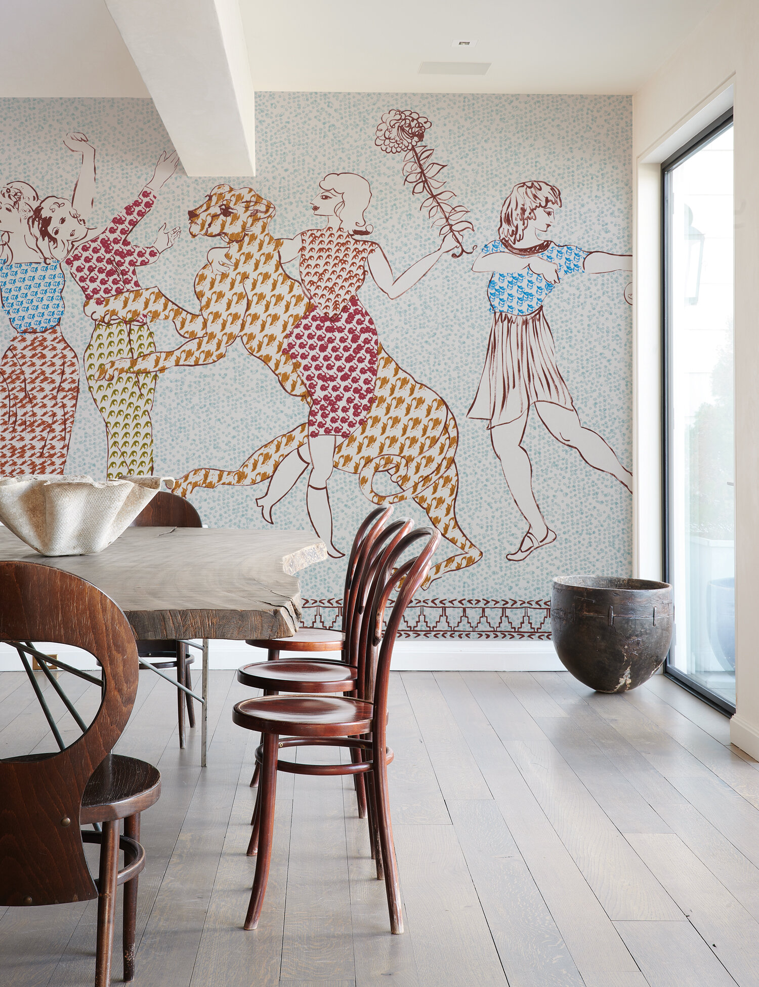 Dining room with graphic wallcovering.
