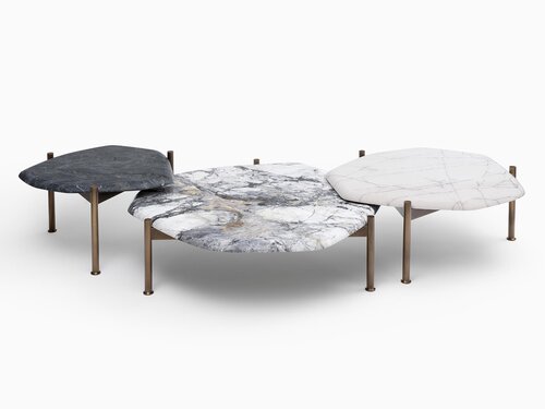 Curved table constructed of three overlapping organic shaped stone tops on a metal base.