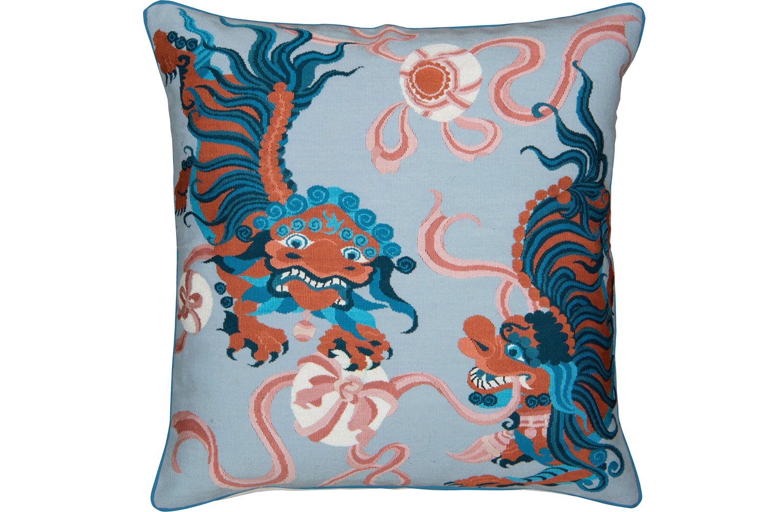 Throw pillow with a dragon patterned fabric.