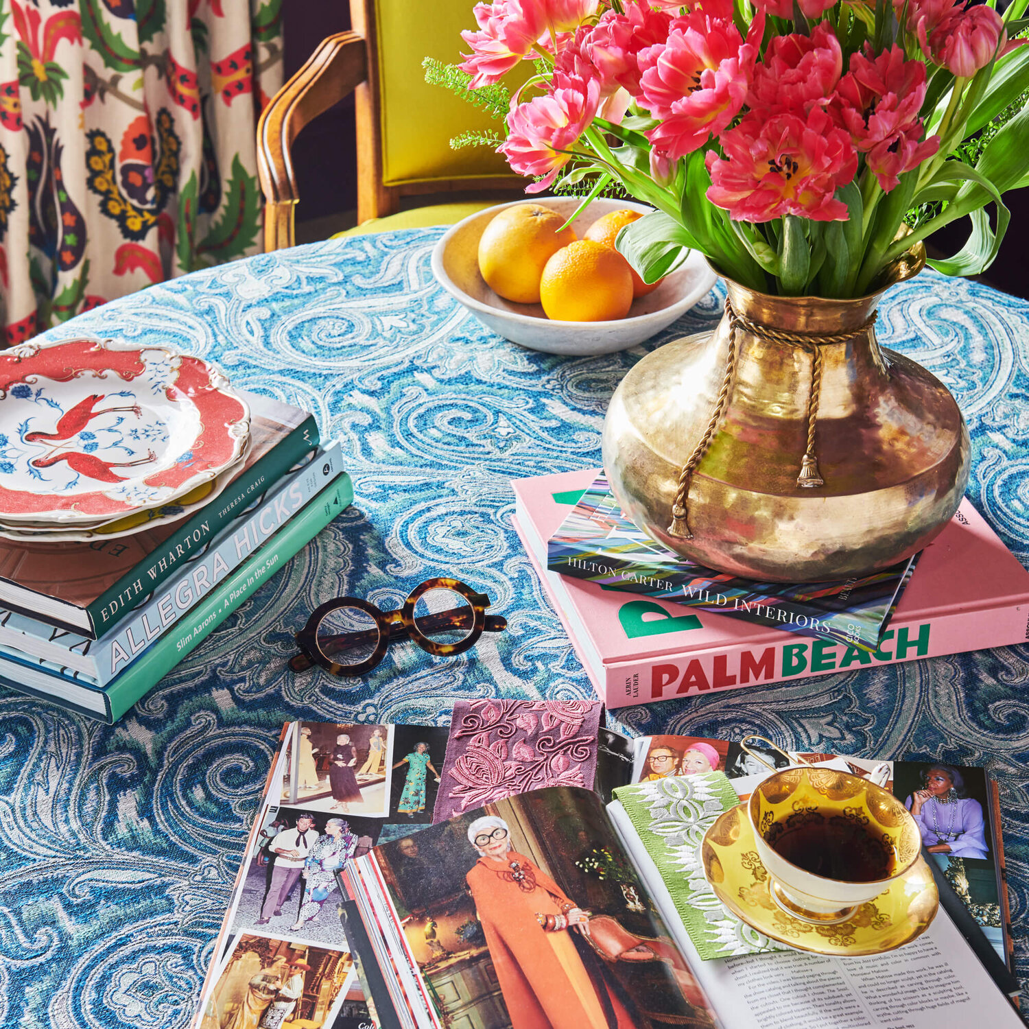 A collection of items on a table in colorful array of patterns and textures.