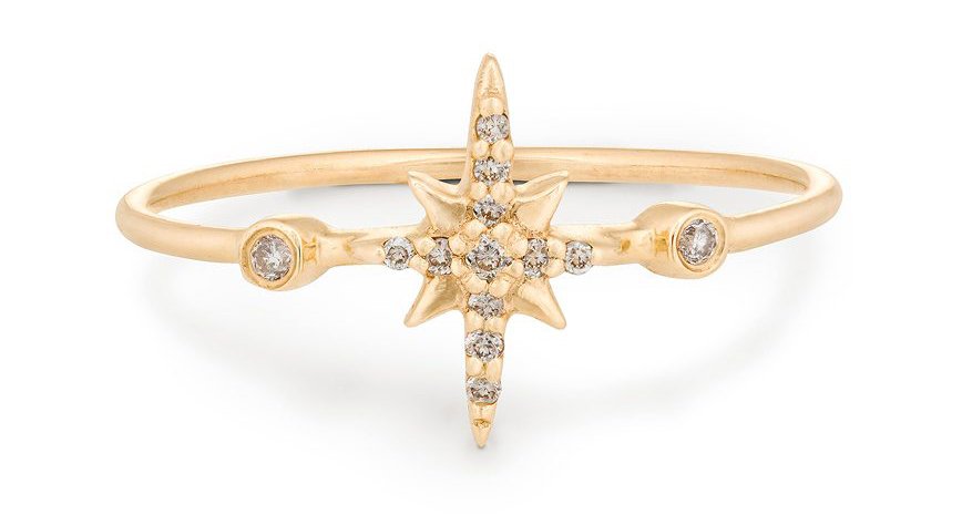 Gold ring with starfish shape center of diamonds and gold.