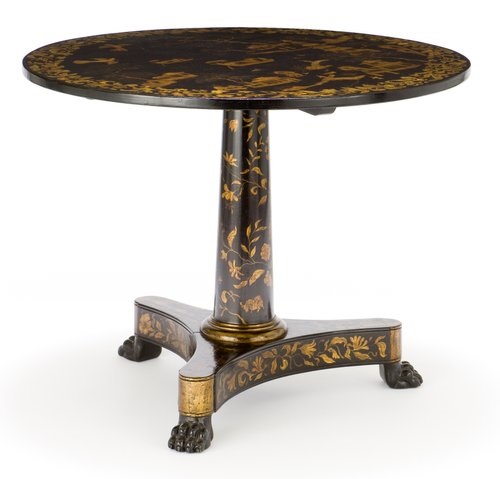 Inlaid round table with pedestal and three carved feet.