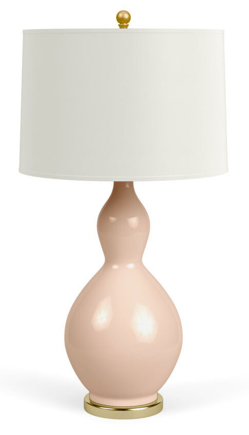 Curvy table lamp with drum shade.