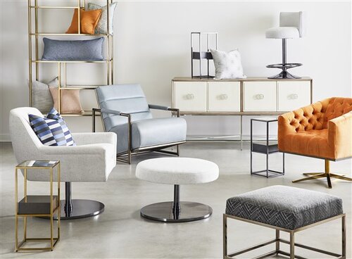 Collection of upholstered low slung seating, ottomans and shelving.