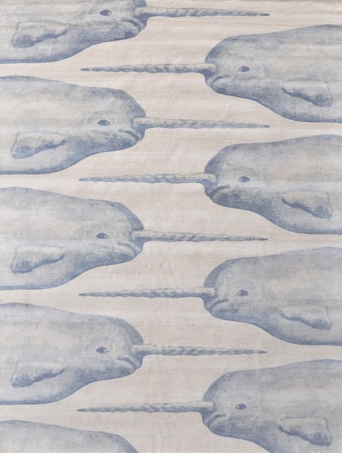 Repeating pattern of aquatic mammal that looks like a whale with a long twisted horn.