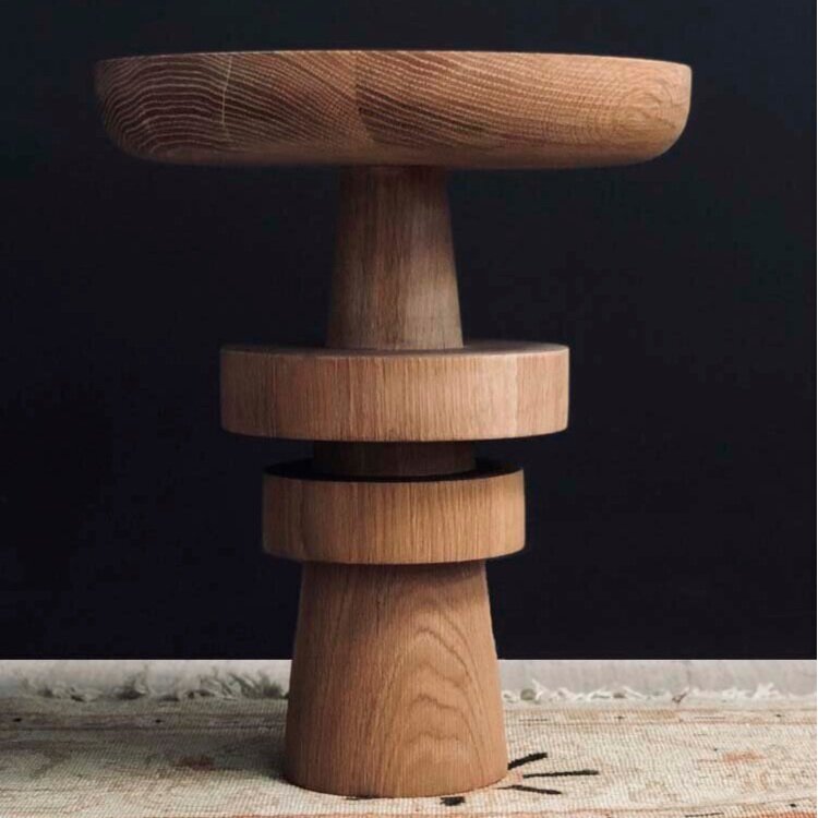 Stacked cylindrical wooden elements as a side table.