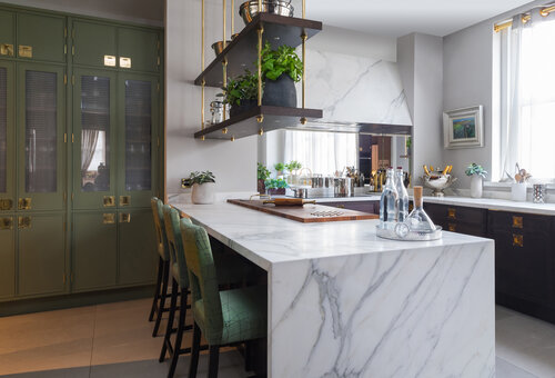 Modern kitchen with marble, wood and metal elements.