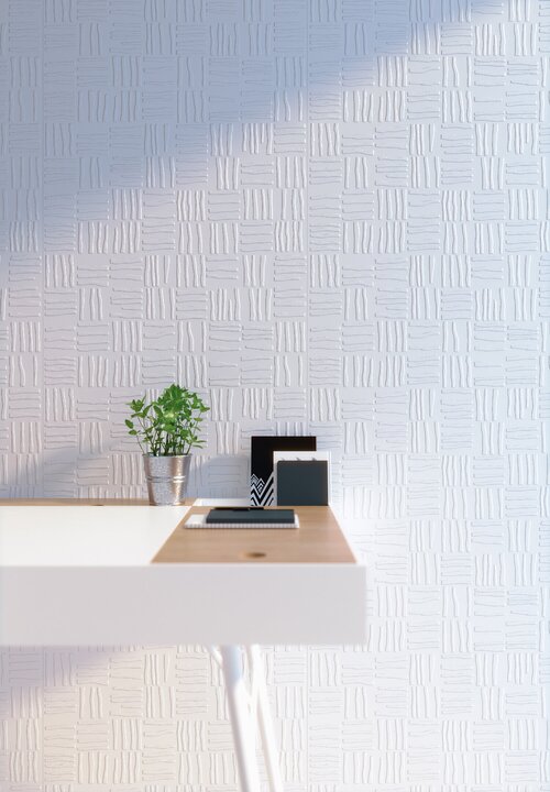 Textured wallpaper behind desk.