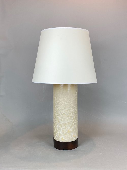 Column table lamp with drum shade.