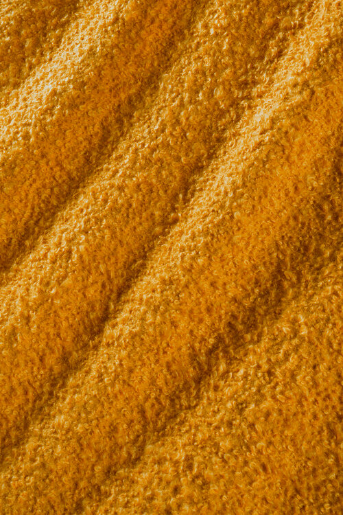 Saffron colored slubby fabric.