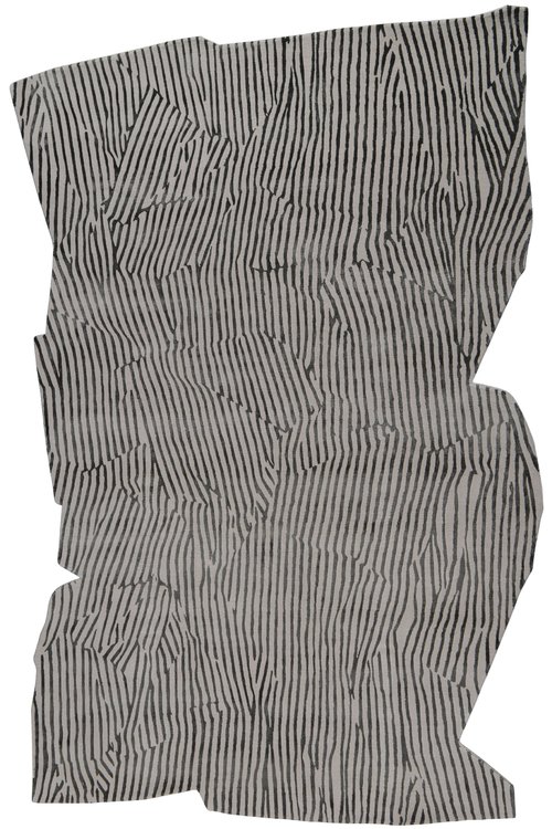 Piece of fabric with intersecting organic stripes.