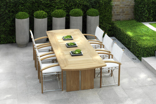 Modern outdoor dining set in an upscale garden.