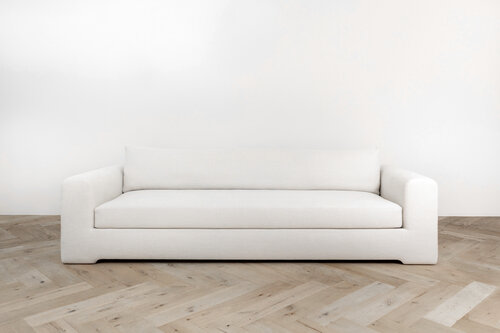 Long low-slung upholstered couch.