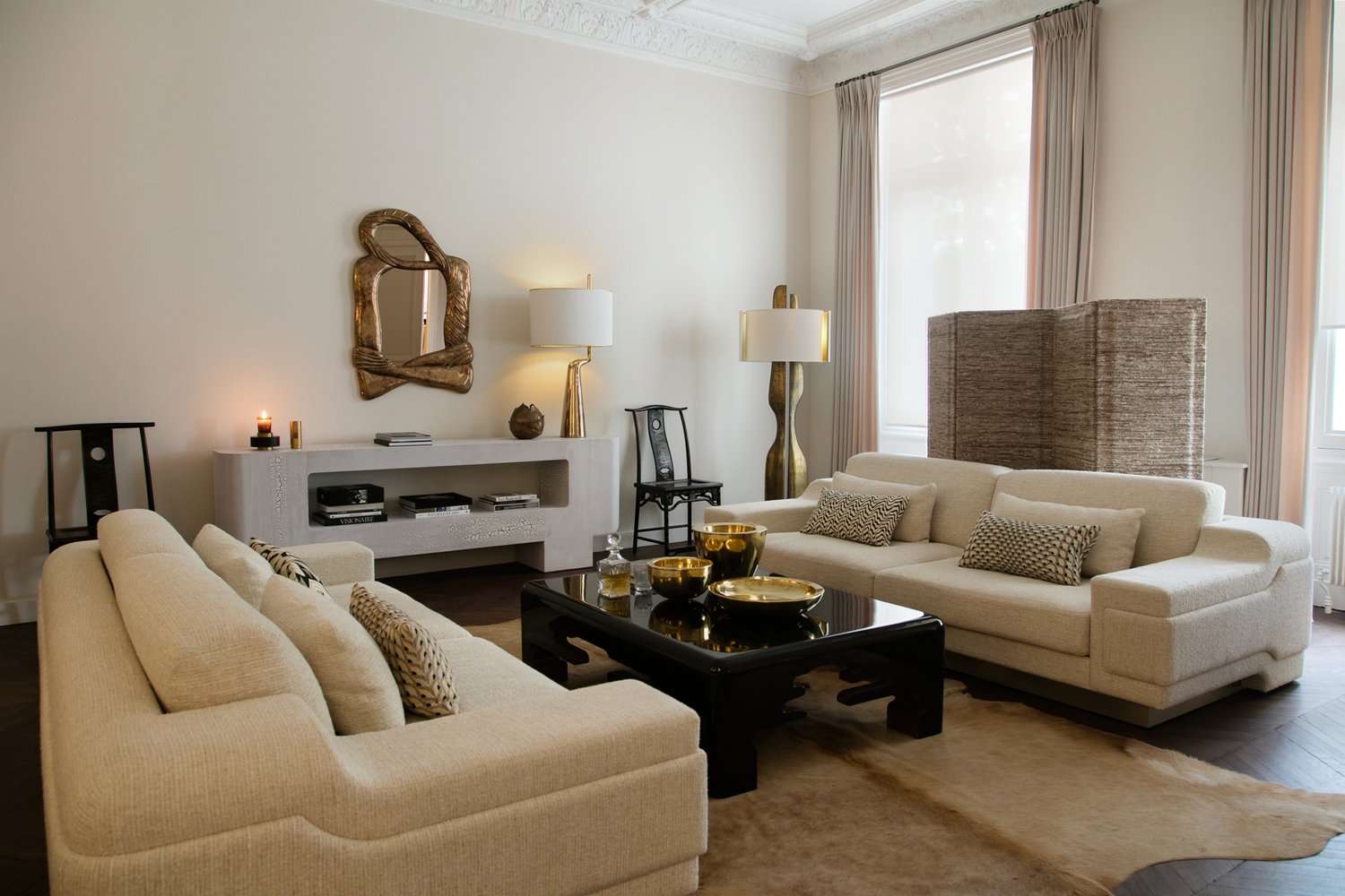 Modern comfortable living room with brass accents.