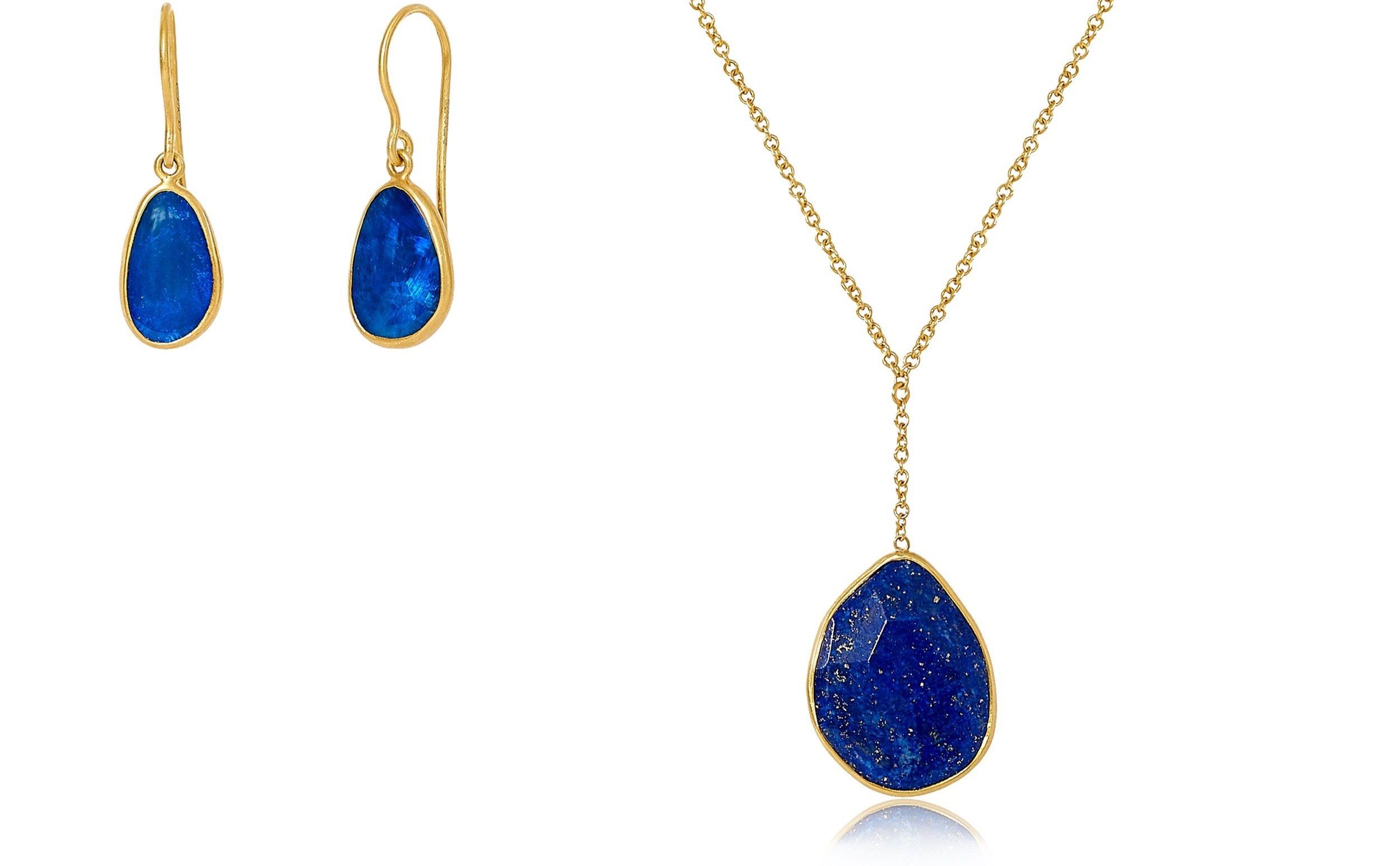 Gold earrings and necklace with deep blue and gold flecked stones.