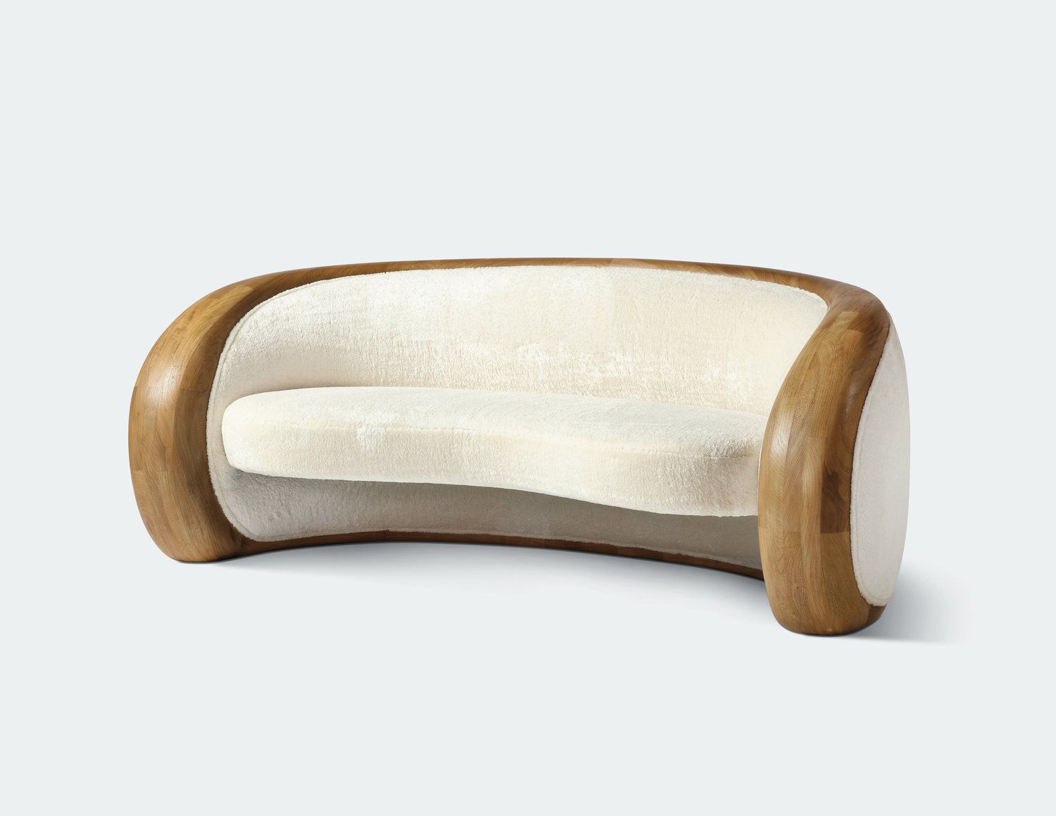 Small curved couch with outline in polished wood.